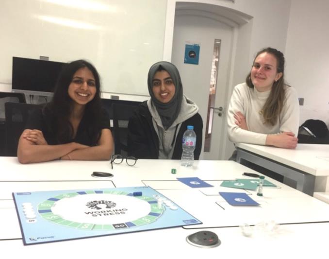 Study group playing a Working Stress boardgame